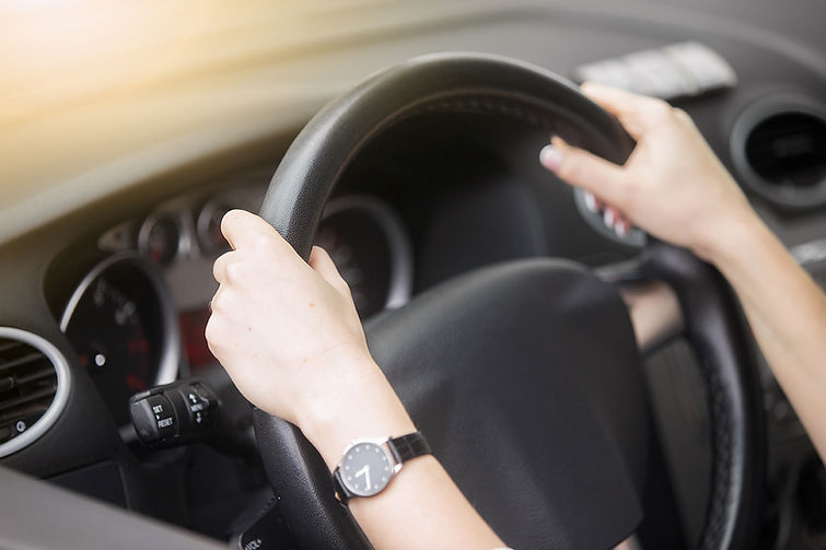 small_portrait-attractive-smiling-woman-driving-car.jpg