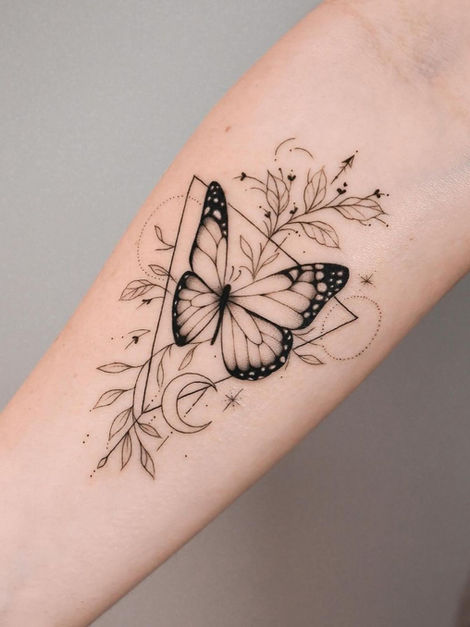 Outlined butterfly surrounded by leaves and flowers on the arm.