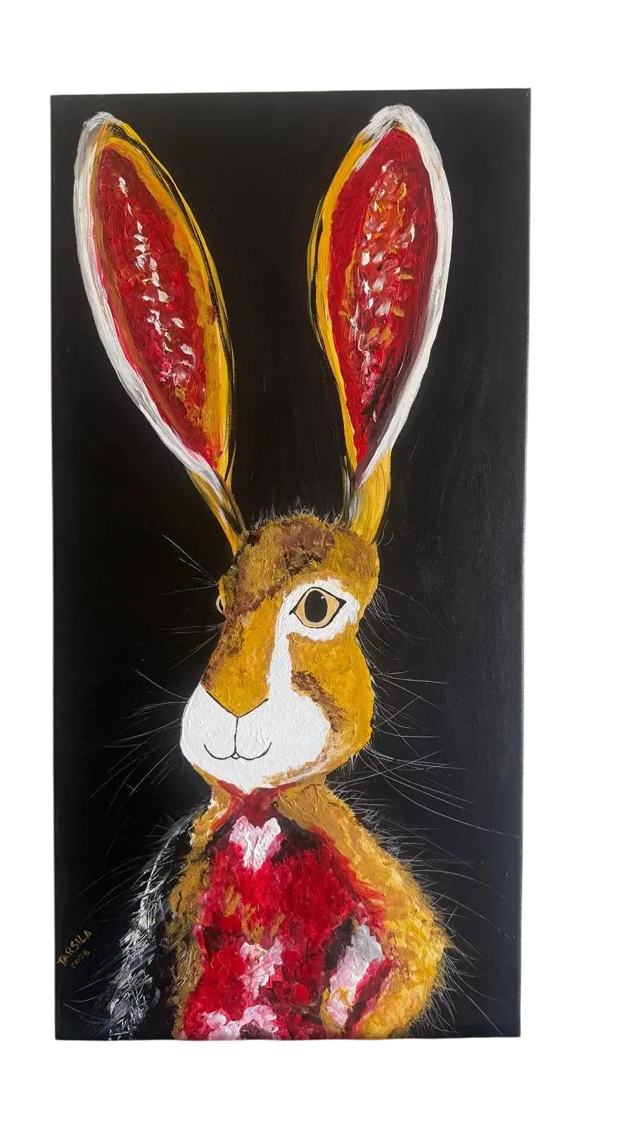 Single hare with tall red ears
