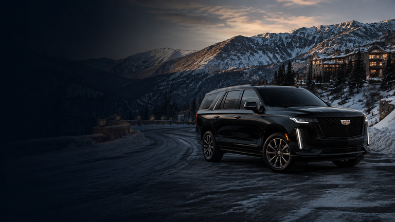 Black SUV traveling through the snowy Wasatch Mountains