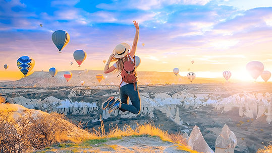 Happy woman watching hot airballoons