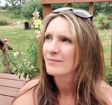 Callie is looking out at flowers and lovely blue skies.