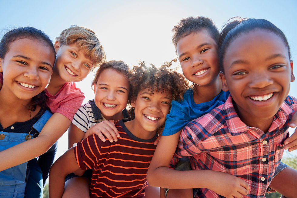 six-pre-teen-friends-piggybacking-in-a-park-close-2021-08-26-16-14-02-utc.jpg