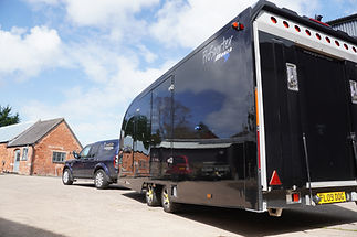 Carscierge car transport vehicle and covered trailer ready for collection