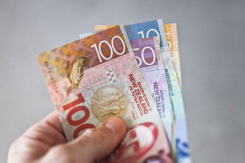 new-zealand-dollars-in-hand.jpg