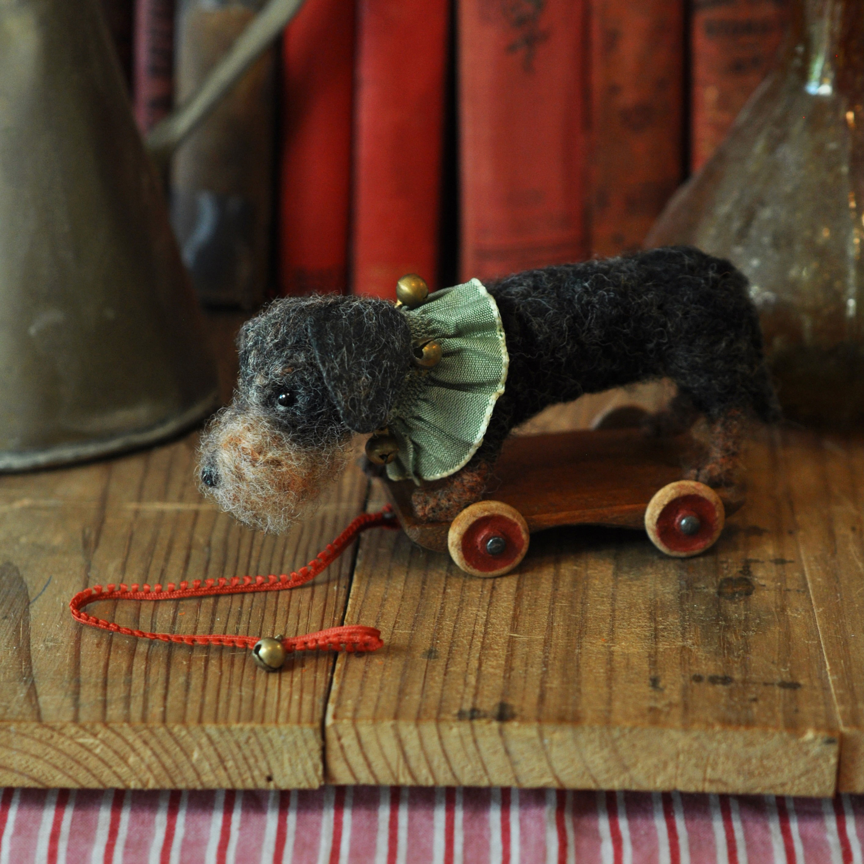 Little Dachshund on his wooden cart