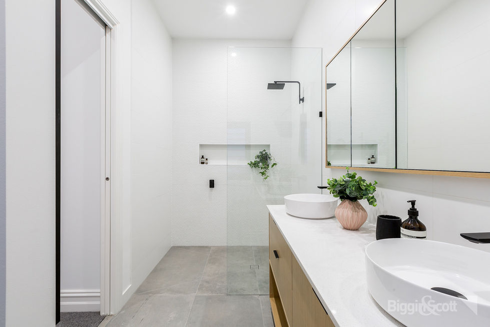 Contemporary Bathroom With Dual Vanity and Frameless Shower