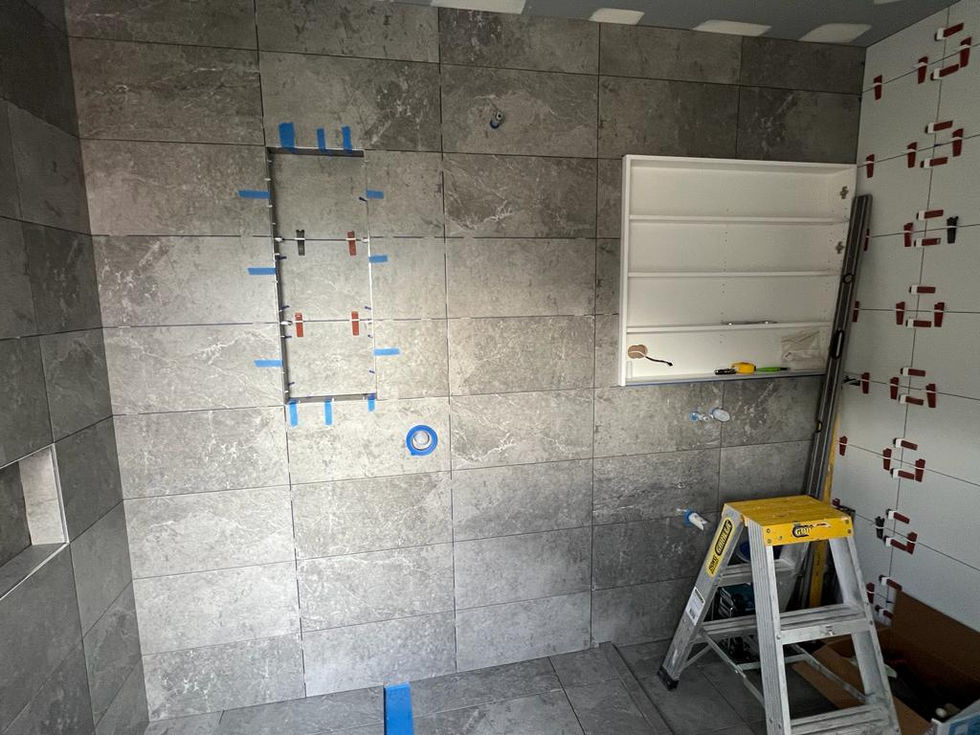 Tiled Bathroom Under Construction With Frameless Shower Design