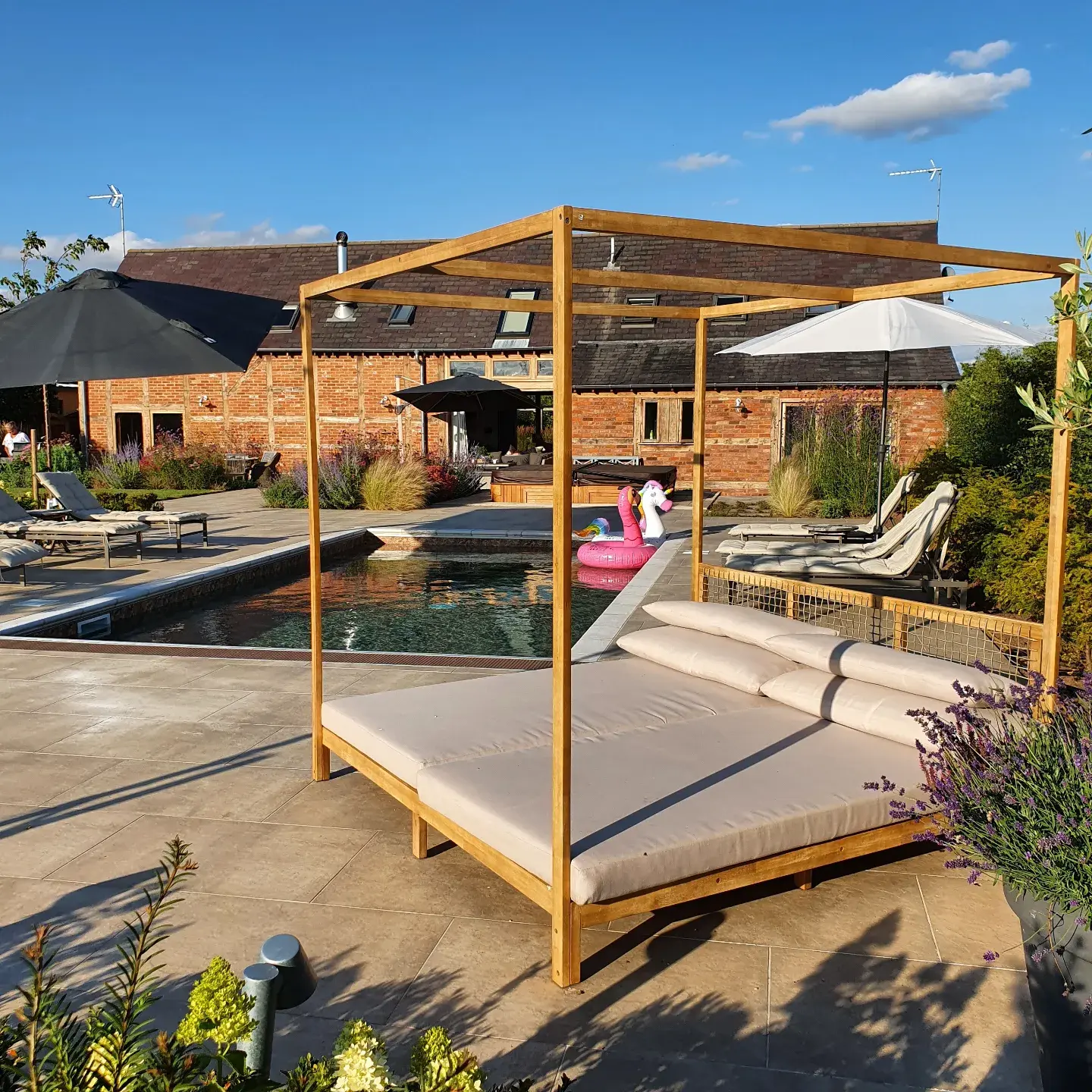 garden day bed in front of a swimming pool