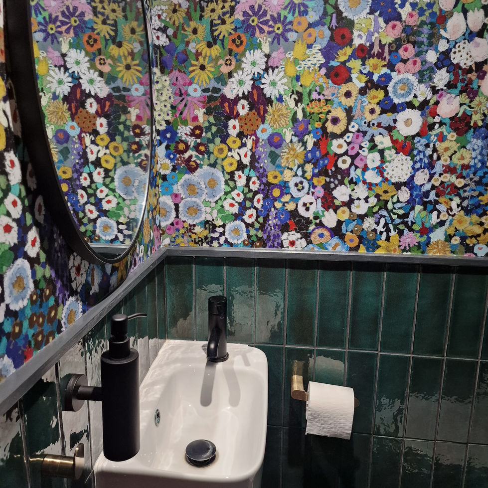 a bathroom with a floral wallpaper and a sink