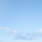 a soft blue sky with very sparse clouds.jpg