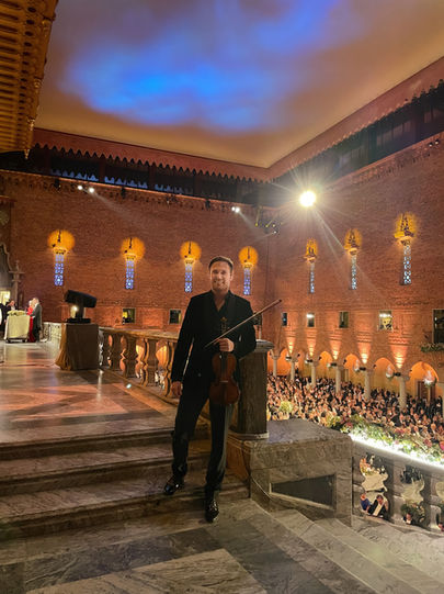 Christian Svarfvar is honored to be one of the select few Swedish artists invited to perform as a soloist at this year’s Nobel Prize Ceremony at Stadshuset in Stockholm – an event renowned for its prestige and cultural significance. The ceremony will be broadcast live on Swedish Television (SVT), reaching audiences across the Nordic countries and beyond.

This year’s artistic program, the divertissement, is a visually and emotionally powerful production where music, dance, and storytelling intertwine to explore themes of challenges, growth, and love.

As the violin soloist, Svarfvar performs from a central position, standing on a pedestal in the grand staircase, creating a visually striking and immersive experience.

The music is composed by Bo Wastesson and arranged and produced by Johan Landqvist.