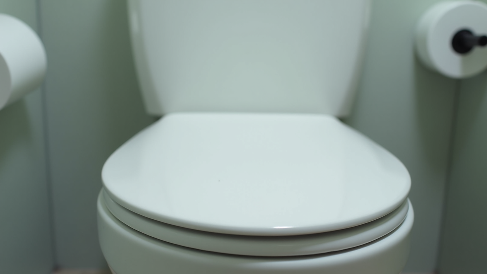 Close-up view of a one-piece toilet’s smooth ceramic surface