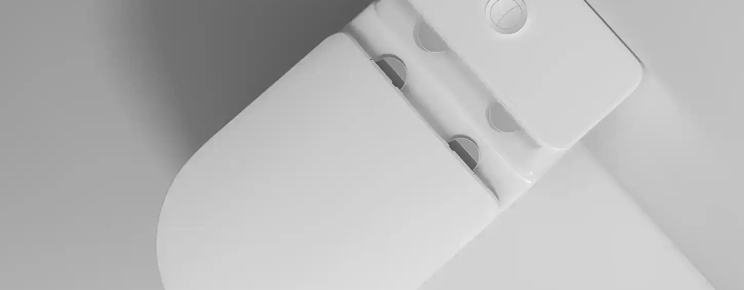 Diagonal top-down image of model SA5015 seamless one-piece toilet, specially designed for hot humid Southeast Asian regions. It comes with an ultra-thin 1cm flat tank lid offering extra countertop storage space, paired with gap-free soft-close seat that eliminates hidden dirt crevices. Nano anti-stain glaze resists mold and yellow stains, while solid ceramic construction ensures long service life. Suitable for condos, landed houses and bathroom renovation projects across Malaysia, Indonesia, Thailand, Singapore and Bangladesh.
