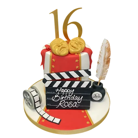 Bespoke cake featuring a film clapper board, theatre masks, and red carpet design in Solihull, West Midlands.