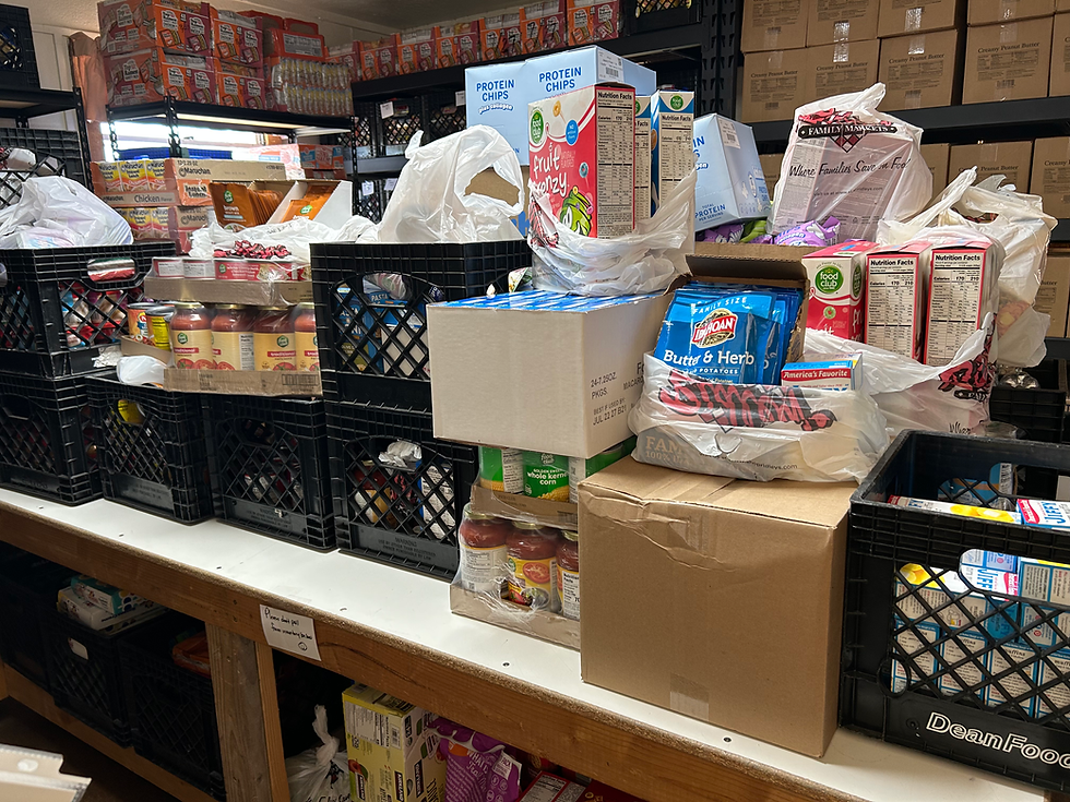Pantry donation table full of food donations
