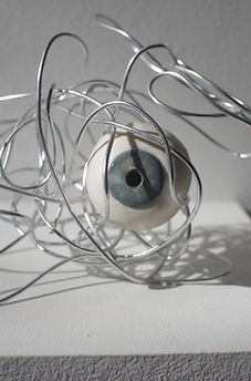Grandma’s eyes, 2023. Porcelain, mason stains, metal wire.