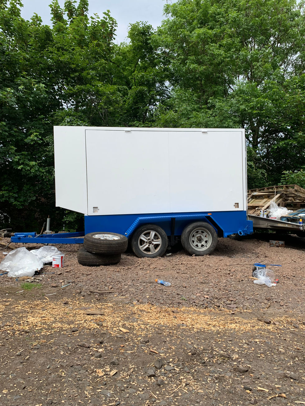 An early photo of the Phonoautobothy's build. The trailer is white, with a blue base.
