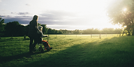 young person pushing older person in wheelchair