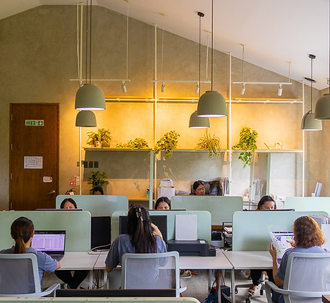 Employees working together in the Surebright office, focused on delivering quality results