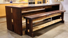 Ah, the versatile kitchen table and bench, doubling up as a kitchen island like a true multitasking champion. Crafted from reclaimed wood, these pieces bring a rustic charm to the heart of your home. The live edges not only add a touch of authenticity but also serve as a constant reminder of the wood's former life. It's like having a conversation starter right in the middle of your kitchen – "Oh, this old thing? It used to be part of a barn!" Who knew your furniture could have such a fascinating backstory? So, whether you're gathering around for a cozy family meal or prepping for a culinary masterpiece, this kitchen table and bench combo has got you covered. It's the perfect blend of style and functionality, proving that furniture can be both practical and oh-so charming. Cheers to the unsung hero of your kitchen – the table that does it all!