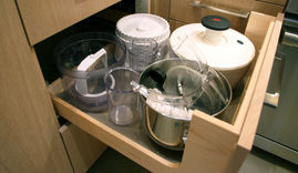 When it comes to storing heavy kitchen appliances in cabinet drawers, there are a few key considerations to keep in mind. First and foremost, it's important to choose sturdy, high-quality drawer slides that can support the weight of the appliances. Soft-close slides are also a great option for preventing slamming and ensuring smooth operation.
Another important factor to consider is the layout and design of the drawers themselves. Deep, wide drawers are ideal for storing heavy appliances such as stand mixers, food processors, and blenders. Additionally, incorporating adjustable dividers or organizers within the drawers can help keep appliances neatly organized and prevent them from shifting during use.
When planning the placement of cabinet drawers for heavy appliances, it's important to take into account their proximity to other work areas in the kitchen. For example, placing a drawer with a heavy stand mixer near the countertop where it will be used can improve efficiency and reduce the risk of injury from lifting and carrying the appliance across the kitchen.
Overall, storing heavy kitchen appliances in cabinet drawers requires thoughtful consideration of hardware, drawer design, and placement within the kitchen layout. By prioritizing durability, organization, and accessibility, homeowners can ensure that their appliances are safely and conveniently stored for everyday use.