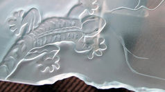 The elegance of etched glass is found in its intricate and delicate patterns that beautifully capture and reflect light. Whether it features a modest frosted design or a complex scene, etched glass brings a touch of sophistication and artistic flair to any area. Its transparent nature provides privacy while also allowing light to pass through, establishing a feeling of spaciousness and lightness. Etched glass is undeniably a timeless and adaptable decorative feature that can elevate the visual appeal of any setting.