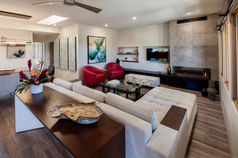 In the realm of interior architecture, infusing a space with splashes of color via furnishings is an excellent means of enlivening it. Whether it be a lively rug, vibrant throw pillows, or a striking piece of furniture, these bursts of color can truly breathe life into a room. By maintaining a neutral palette for architectural elements and introducing color through décor, there's the freedom to switch up the aesthetic at will. It's a delightful and uncomplicated way to imbue your space with personalization, creating an inviting and distinctive ambiance.