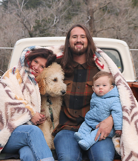 Owner of Elevate GreenWorks Lawn Care with his family and dog in the bed of a classic orange 1969 Ford F-250