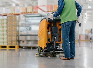 worker cleaning floor with machine.jpg
