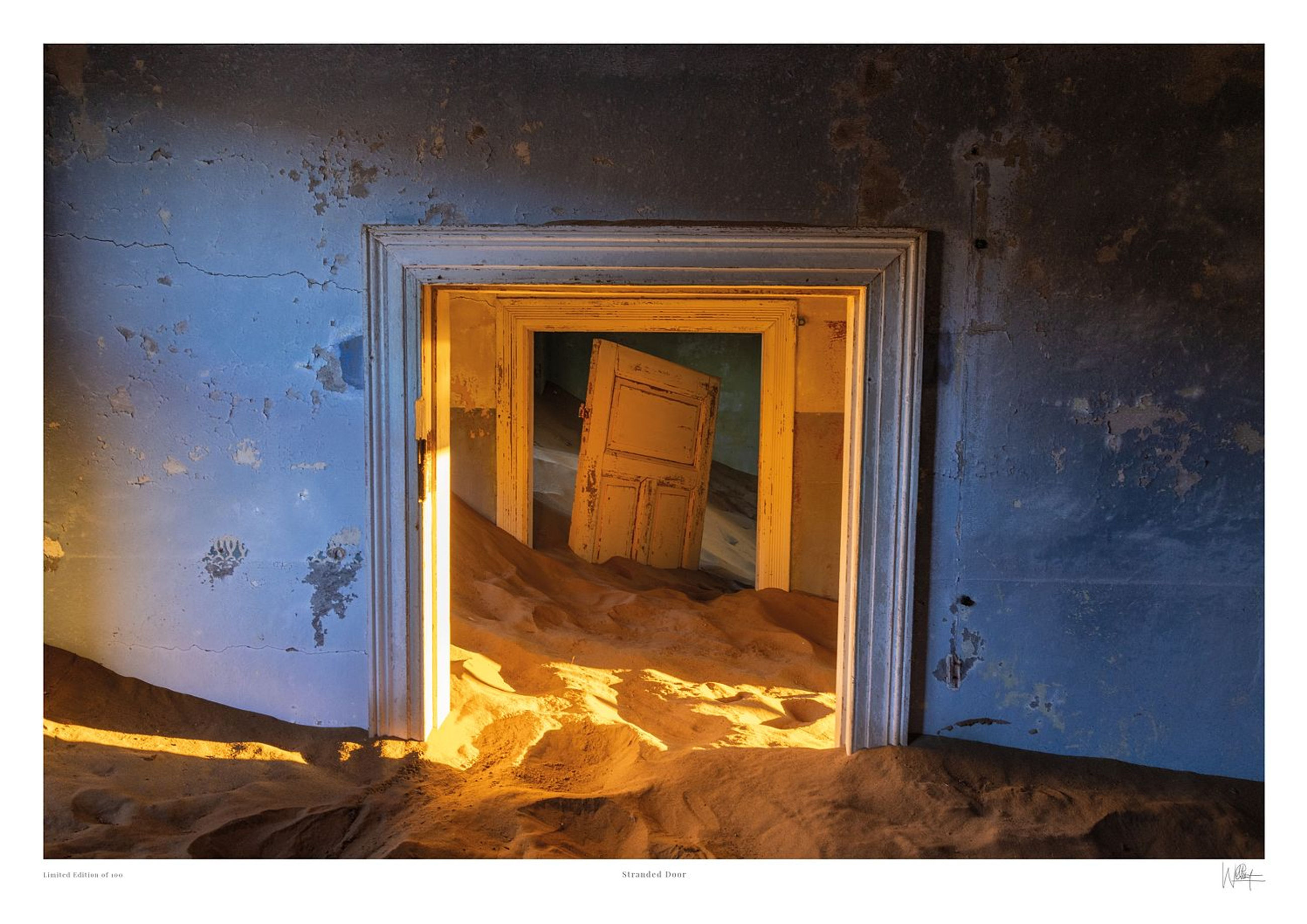 Exhibition quality fine art print of windblown desert sand filling an abandoned room in Kolmanskop Namibia by Will Gray