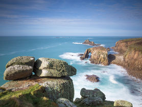 Clear sunny day at Land's End, showing the rock arch and Armed Knight Island