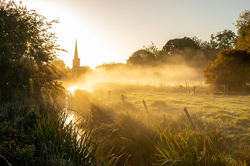 Sunrise over the misty water meadows at Burford in the English Cotswolds, Will Gray Photography