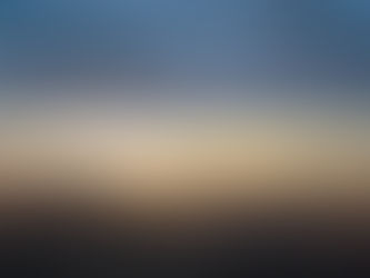 Hot air balloon floating over Namib Desert at sunrise