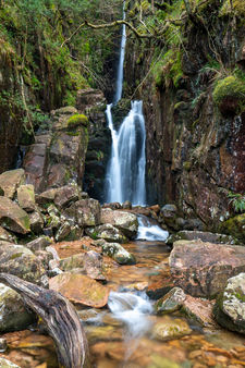 Waterfall cascading over rocks in the Lake District