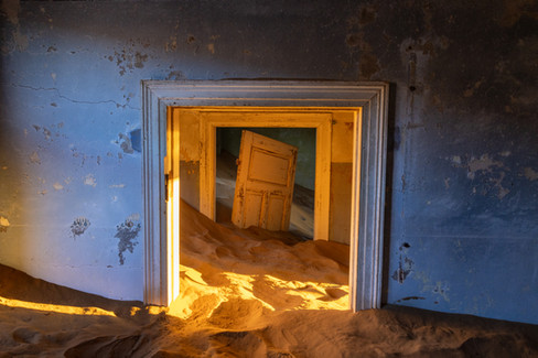 Blue wall, stranded door, Kolmanskop, Namibia, photography workshop, Will Gray