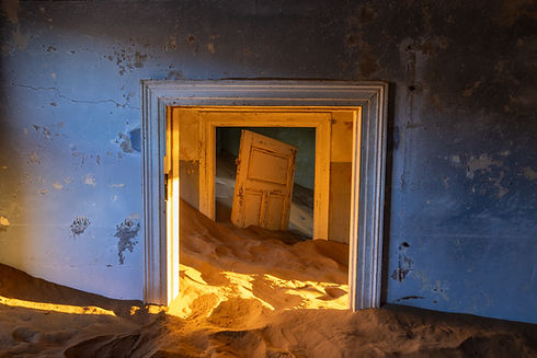 Sand-filled rooms in Kolmanskop, Namibia photography by Will Gray