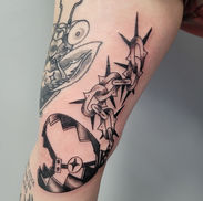 Black and gray bear trap and chain tattoo on the arm by Erin at Acme Tattoo Co.