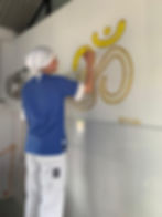 Lea Blankenberg decorating dairy with Om sign