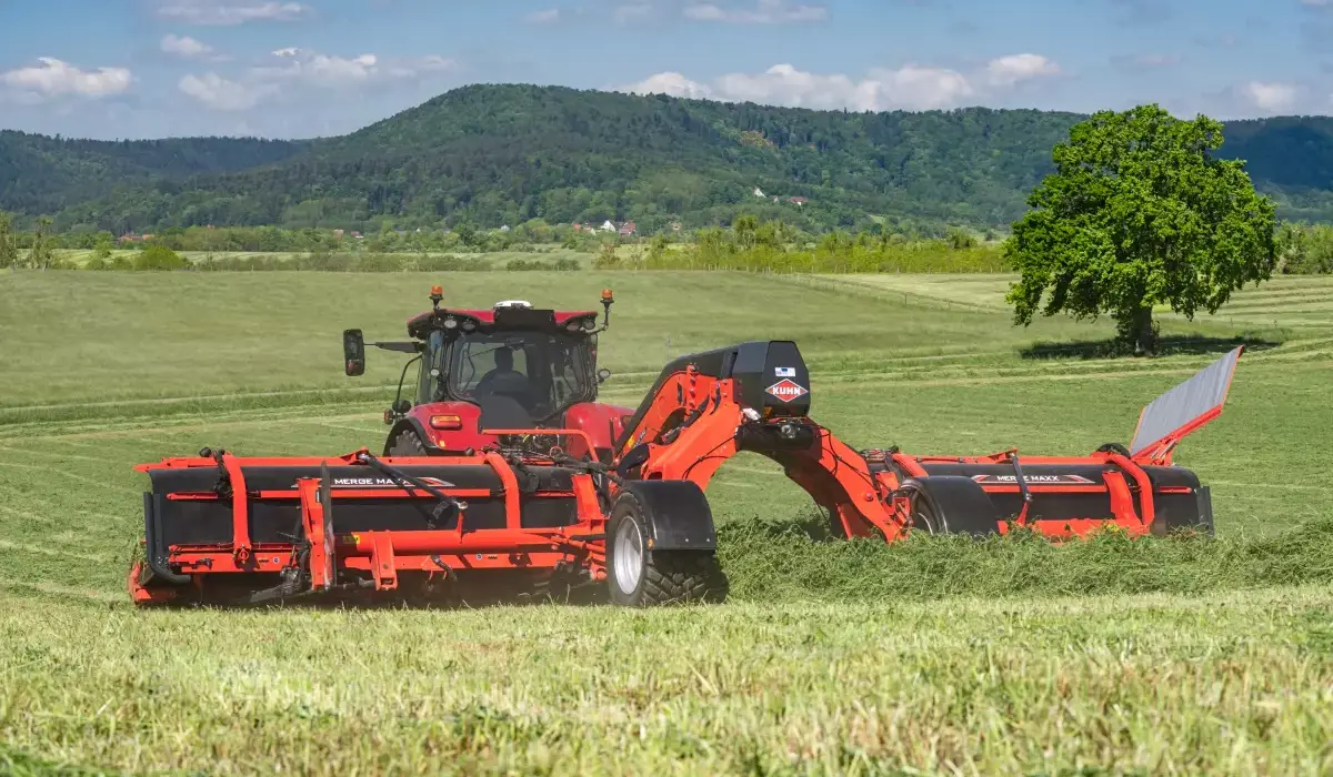 MM 952 & 1092 Center-Delivery Twin Mergers attached to tractor rear, in field