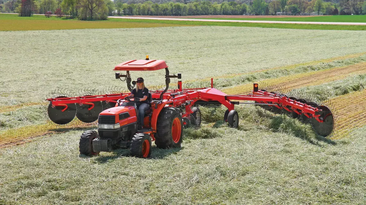 SR 300 Series Wheel Rake attached to tractor rear, in field