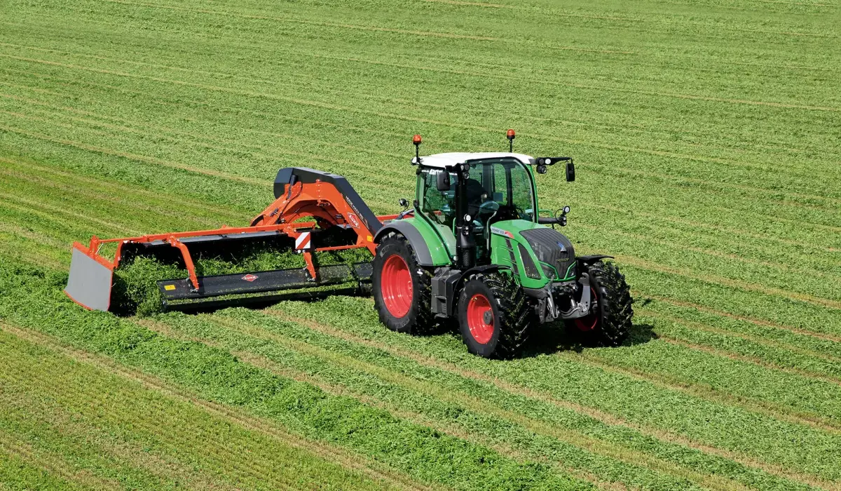 MM 950 & 1090 Center-Delivery Twin Merger s attached to tractor rear, in field