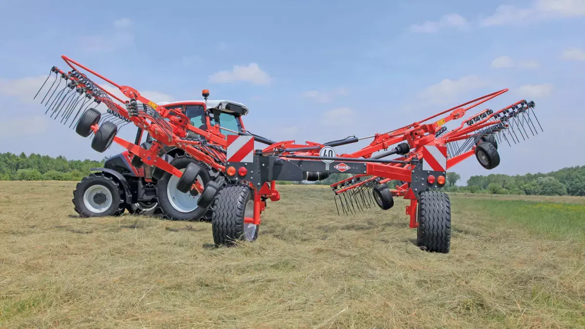 GA 6501 / 7501+ Twin-Rotor Rotary Rake attached to tractor rear, in field