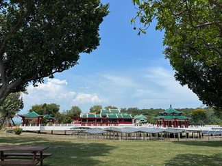 chinese temple through trees across park on kusu island singapore