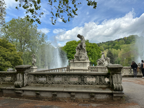 statue at the top of the fountain at parco del valentino in turin italy