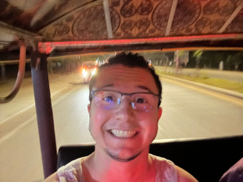 author on a tuk tuk in cambodia