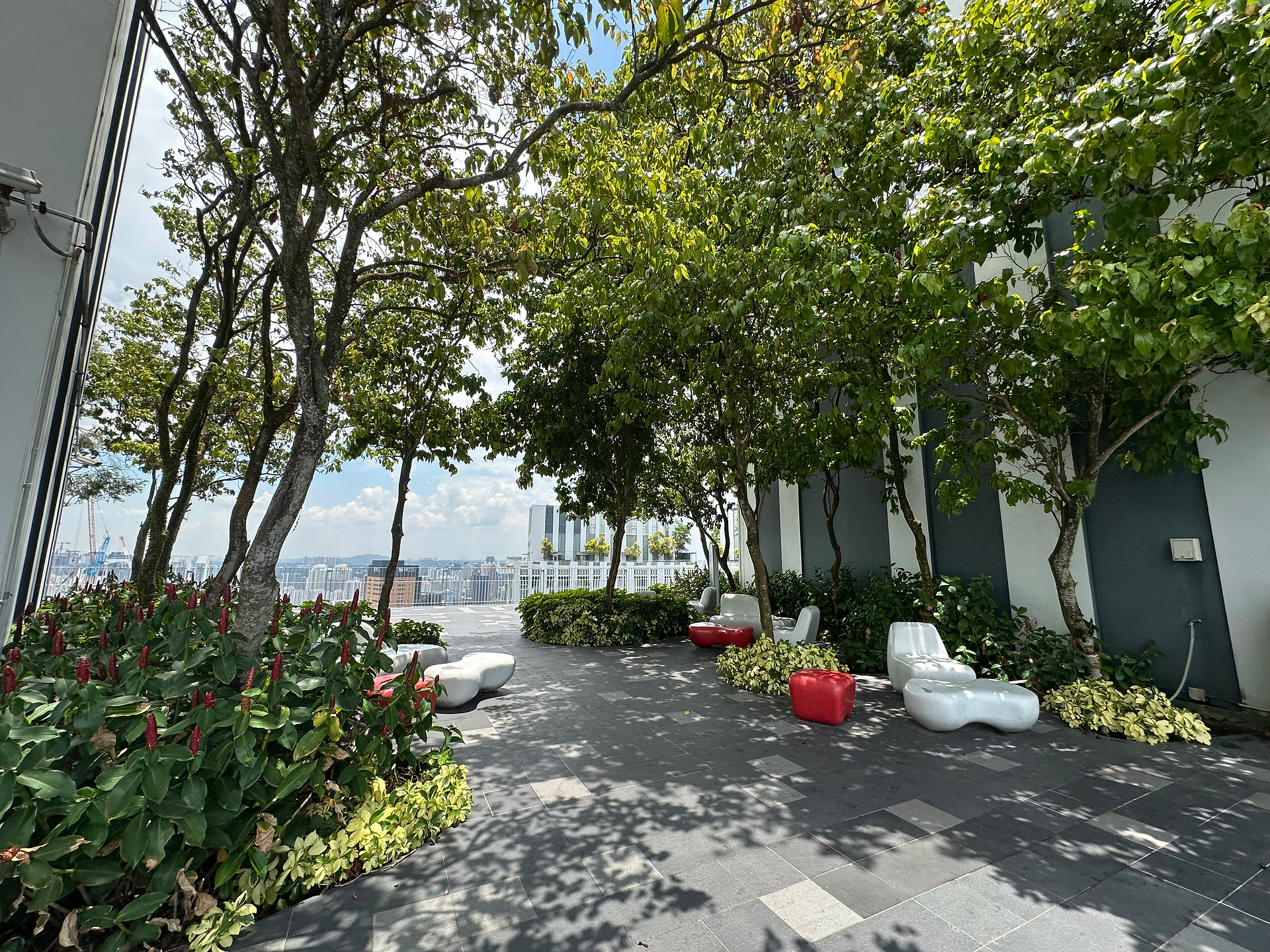 shaded seating area in garden at the pinnacles at duxton singapore