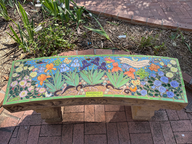colorful ceramic bench with aloe and butterflies in tucson botanical garden