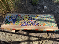 colorful ceramic bench with purple flowers in tucson botanical garden