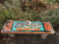 colorful ceramic bench with moon and plants in tucson botanical garden